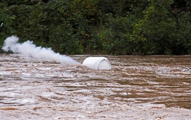 propane tank floating down river during Hurricane Irene